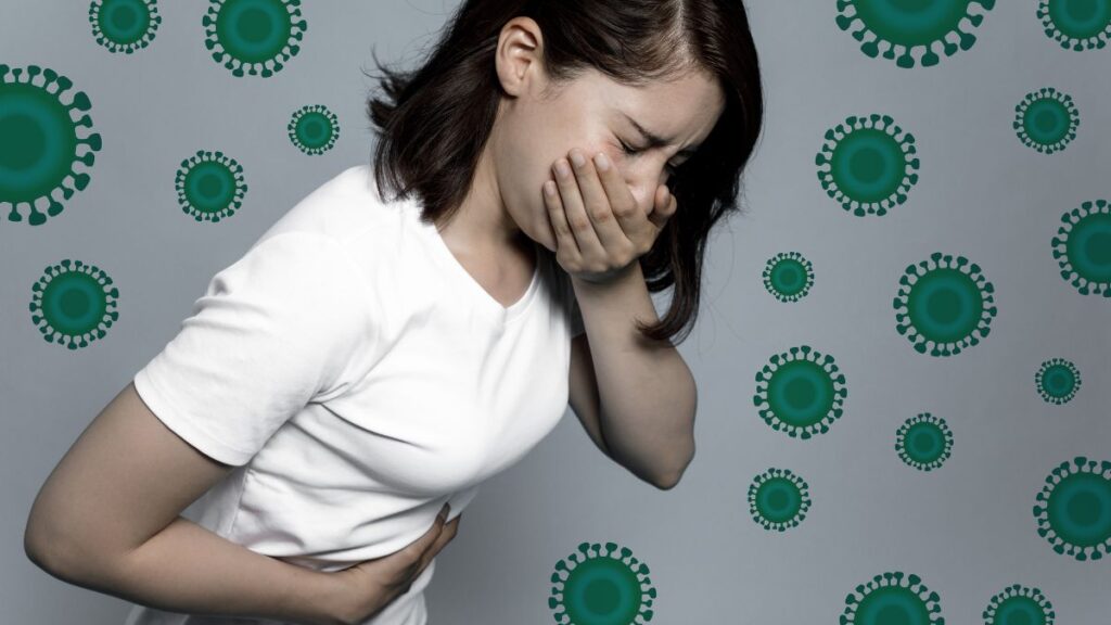 mulher-jovem-com-as-maos-na-barriga-e-na-boca-conceito-de-infeccao-por-virus-shutterstock